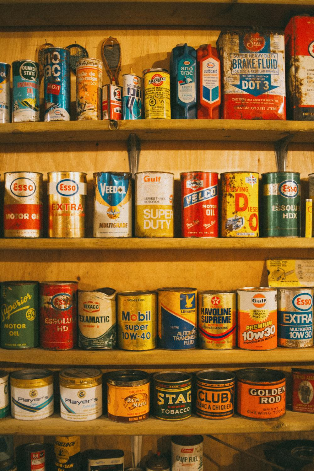 Multiple labeled tin cans neatly arranged on a retail shelf