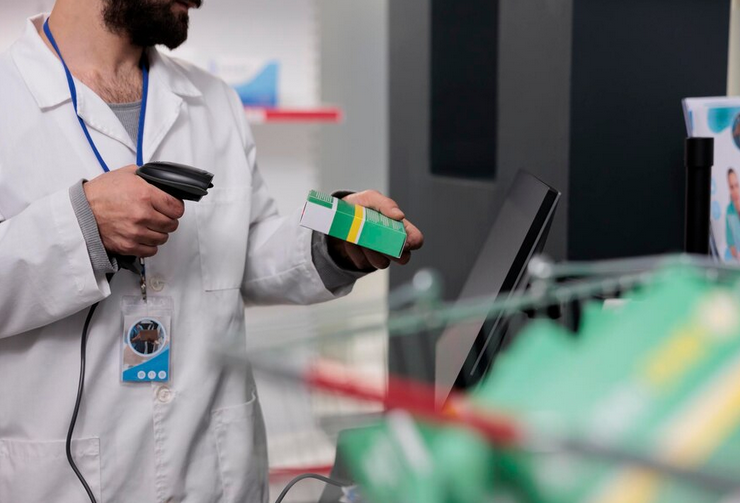 A picture of a person scanning a barcode of a medical product