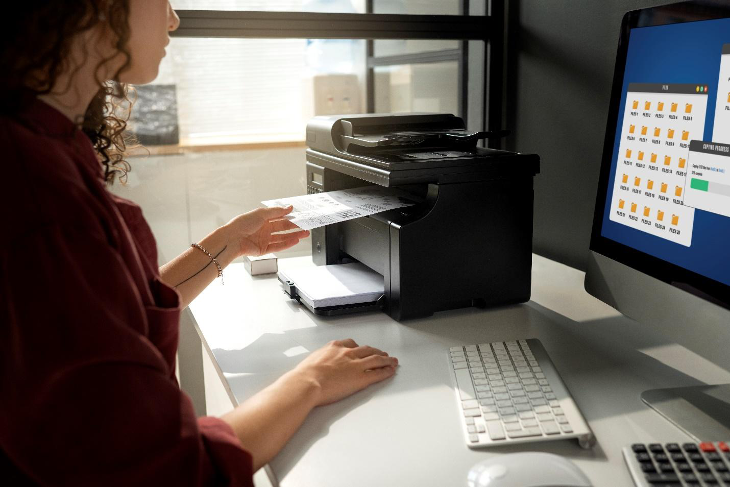 A picture of a person using a printer