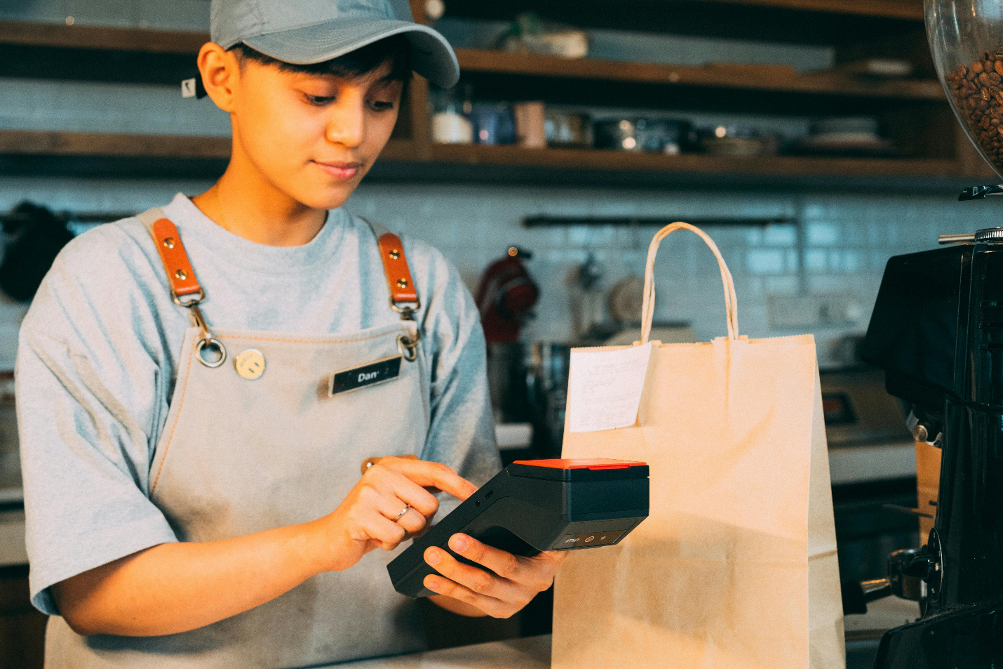 A picture of a person using a POS printer