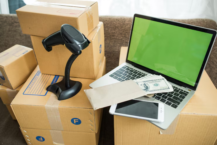 Boxes, laptop, dollar-bills