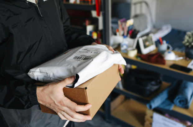A picture of a parcel with a barcode label 